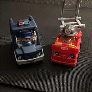 Fisher-Price Little People Blue Police Car and Red Fire Truck Set with people.